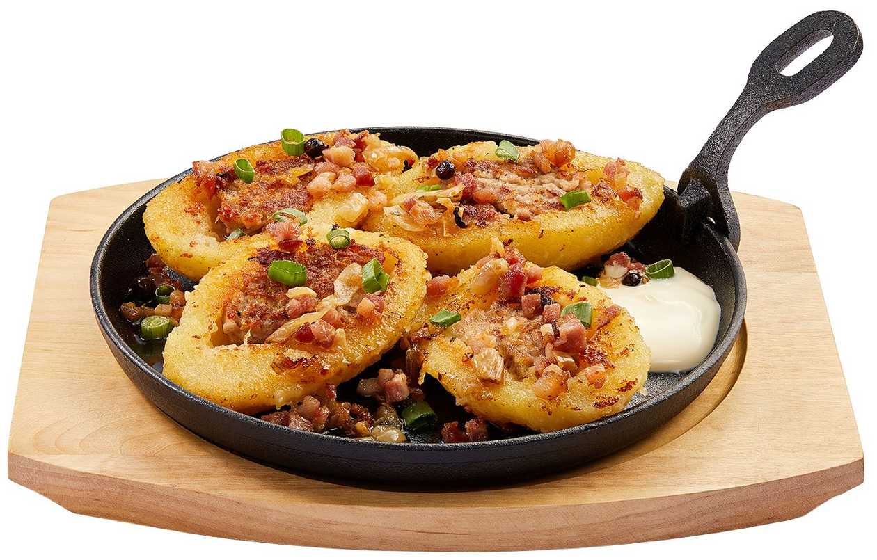 Fried dumplings stuffed with meat with crackling sauce and sour cream