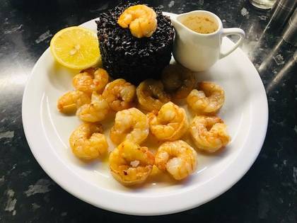 Shrimp with butter sauce and black rice