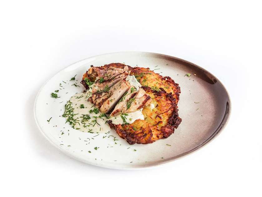 Swiss potato pancakes "Rosti" with chicken and mushroom sauce