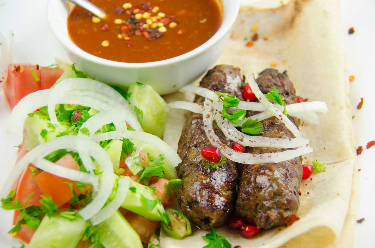 Beef Kebab Lavash With Cucumber-Tomato Salad And Tomato Sauce