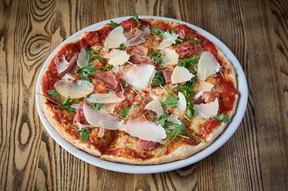 Pizza with Serrano ham and Grana padano cheese