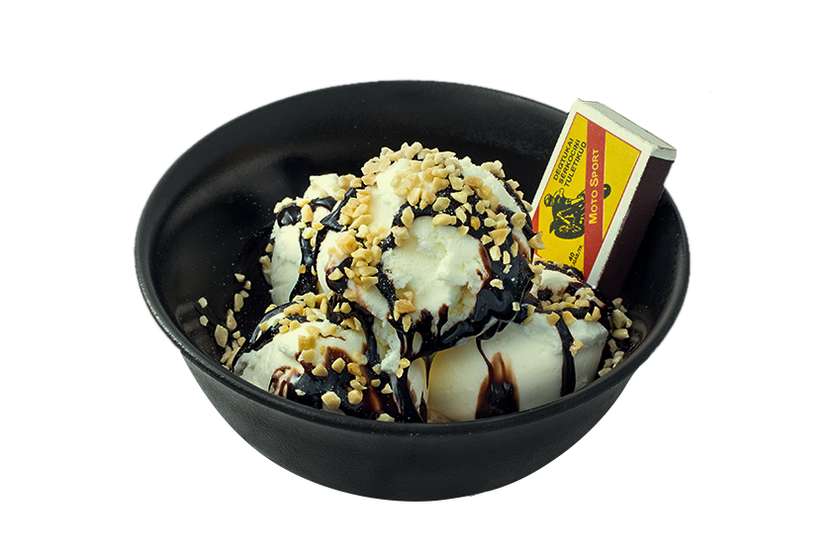 Ice cream with chocolate sauce and crumbled nuts