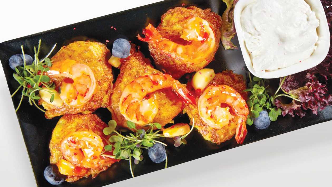 Potato rostti with tiger prawns and creamwith horseradish