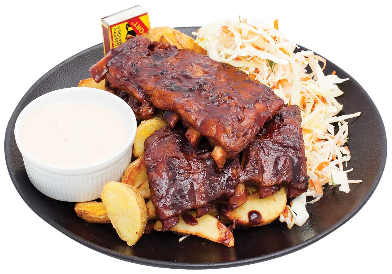 Ribs in BBQ marinade with french fries or potato wedges