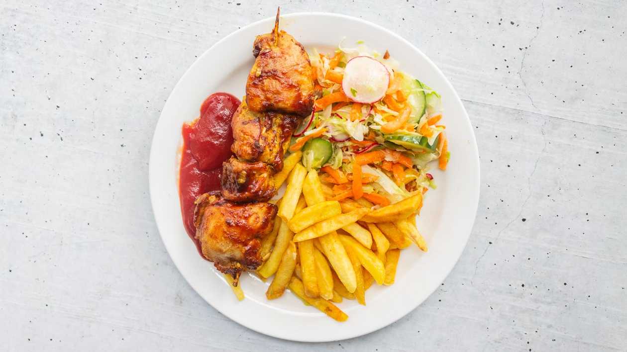 Chicken skewers with french fries