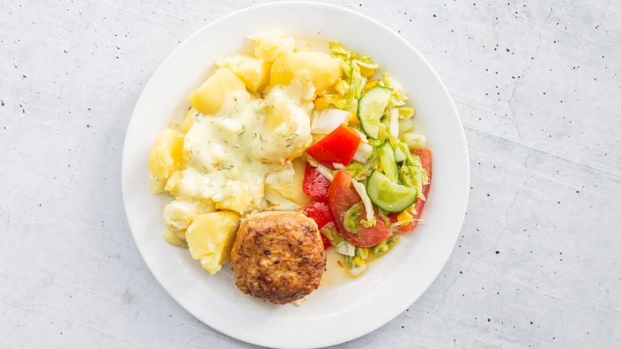 Pork chop with cheese and boiled potatoes