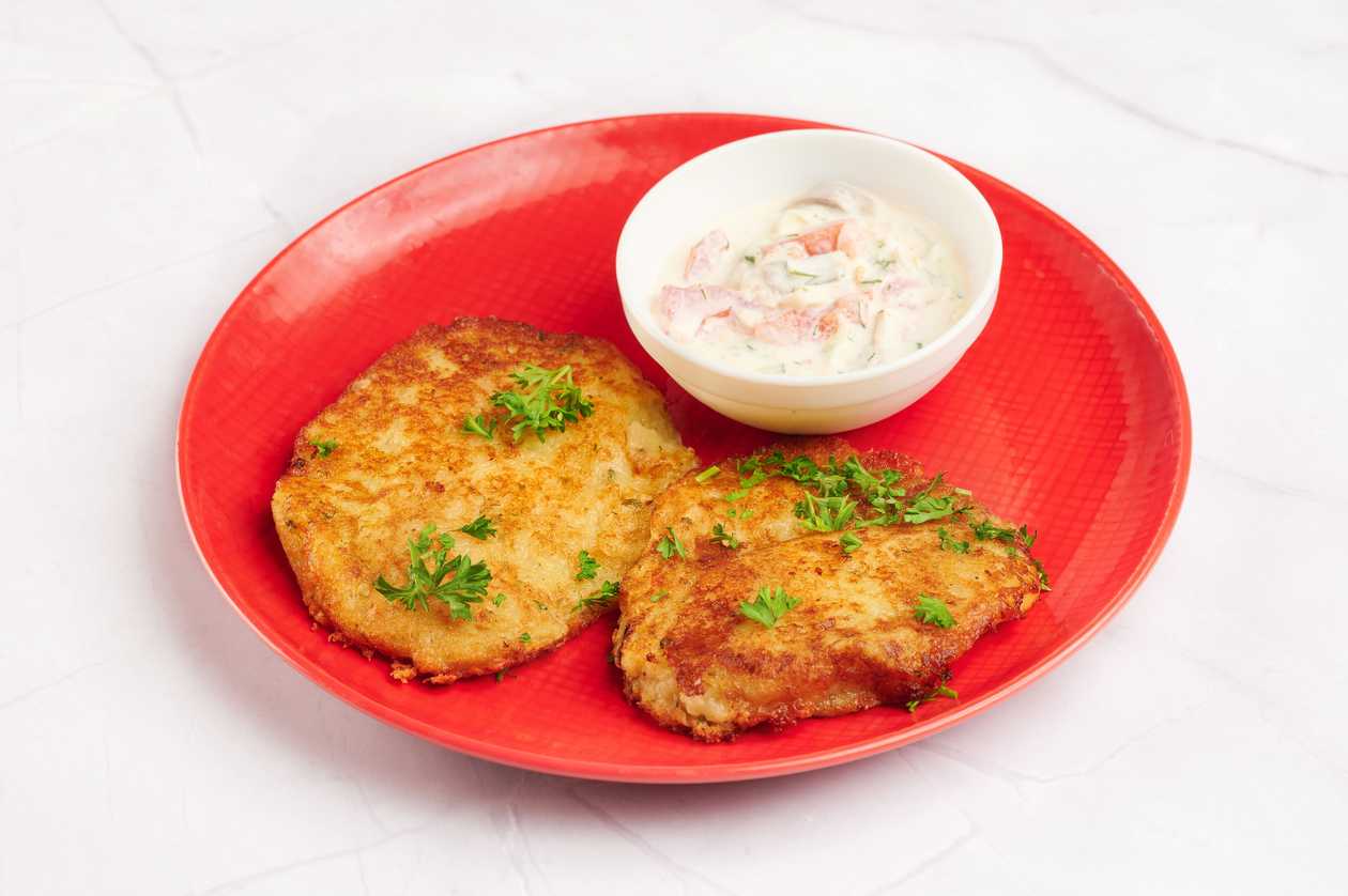 Potato pancakes with herring sauce