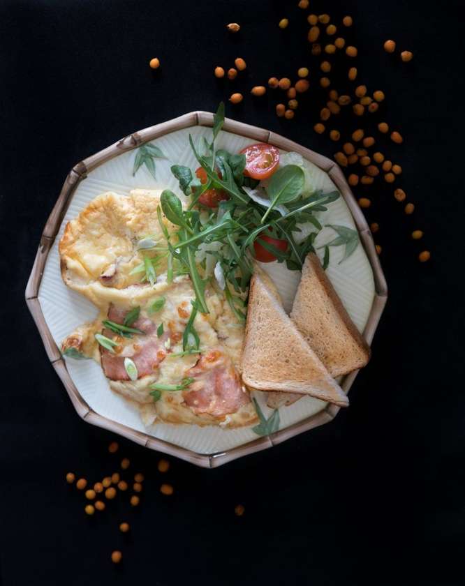 Omelette with ham with cheese and green salad