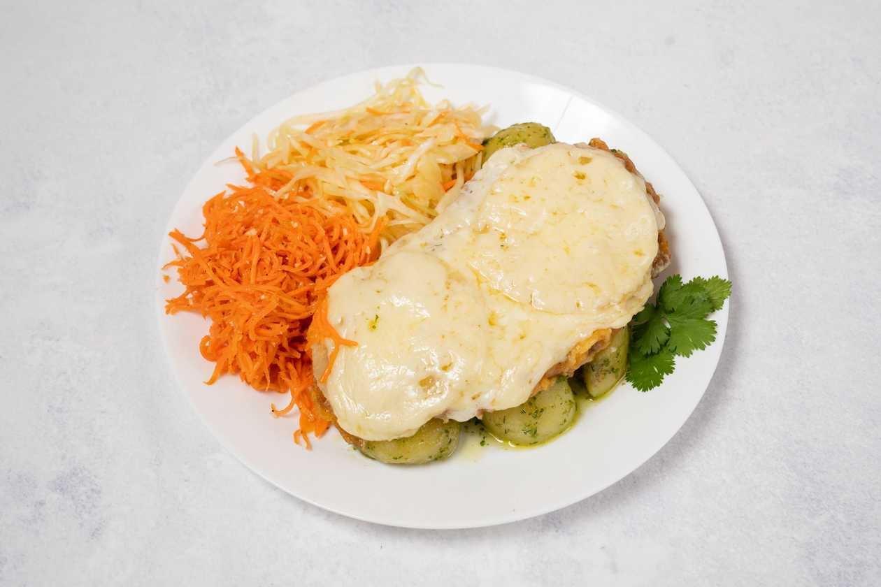 Chicken fillet steak baked with tomatoes and cheese