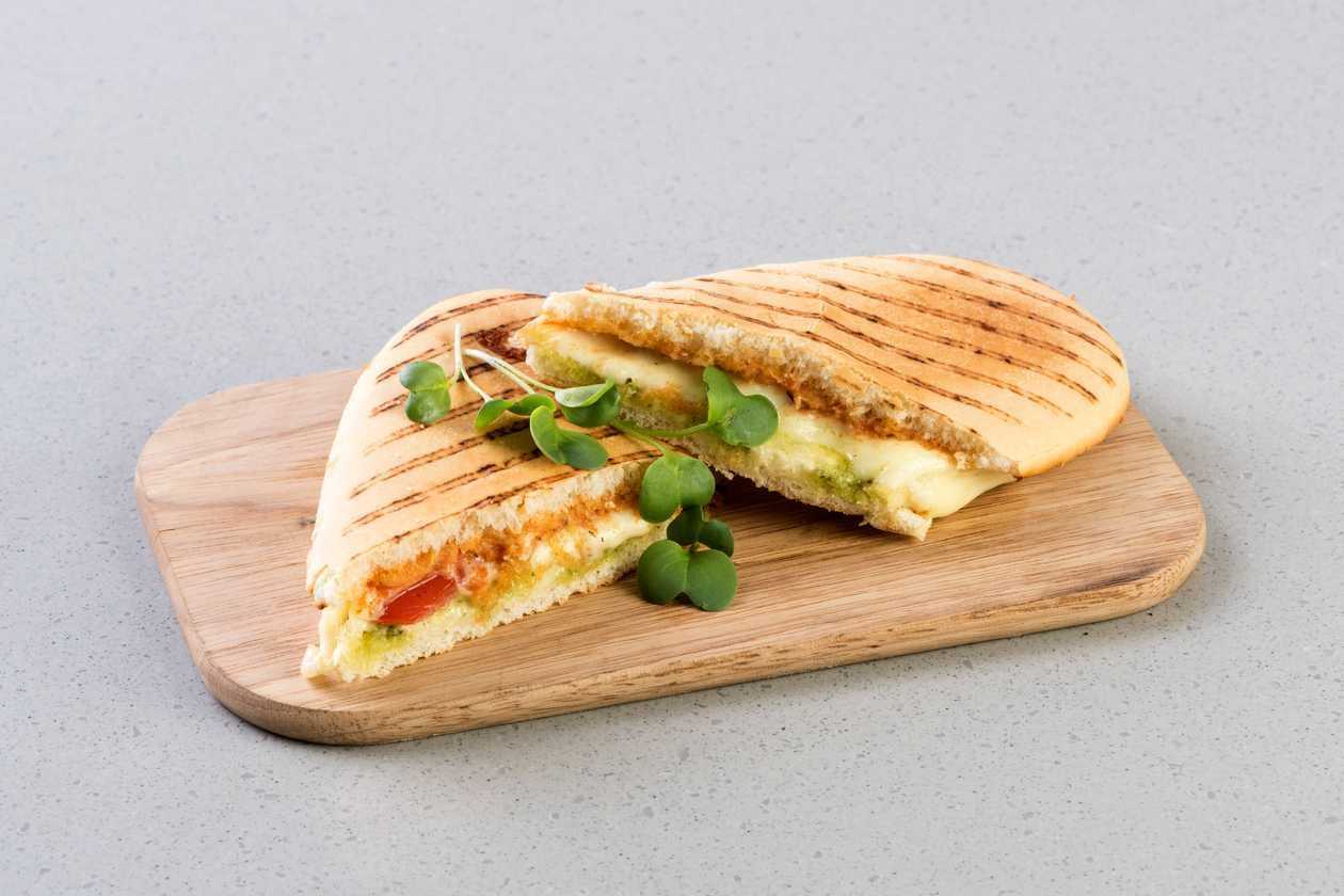 Panini with tomatoes, mocarella, pesto and napolitana sauce