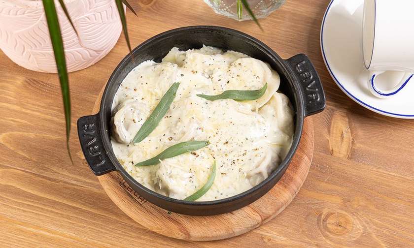 Beef Pelmeni with cream souce and cheese
