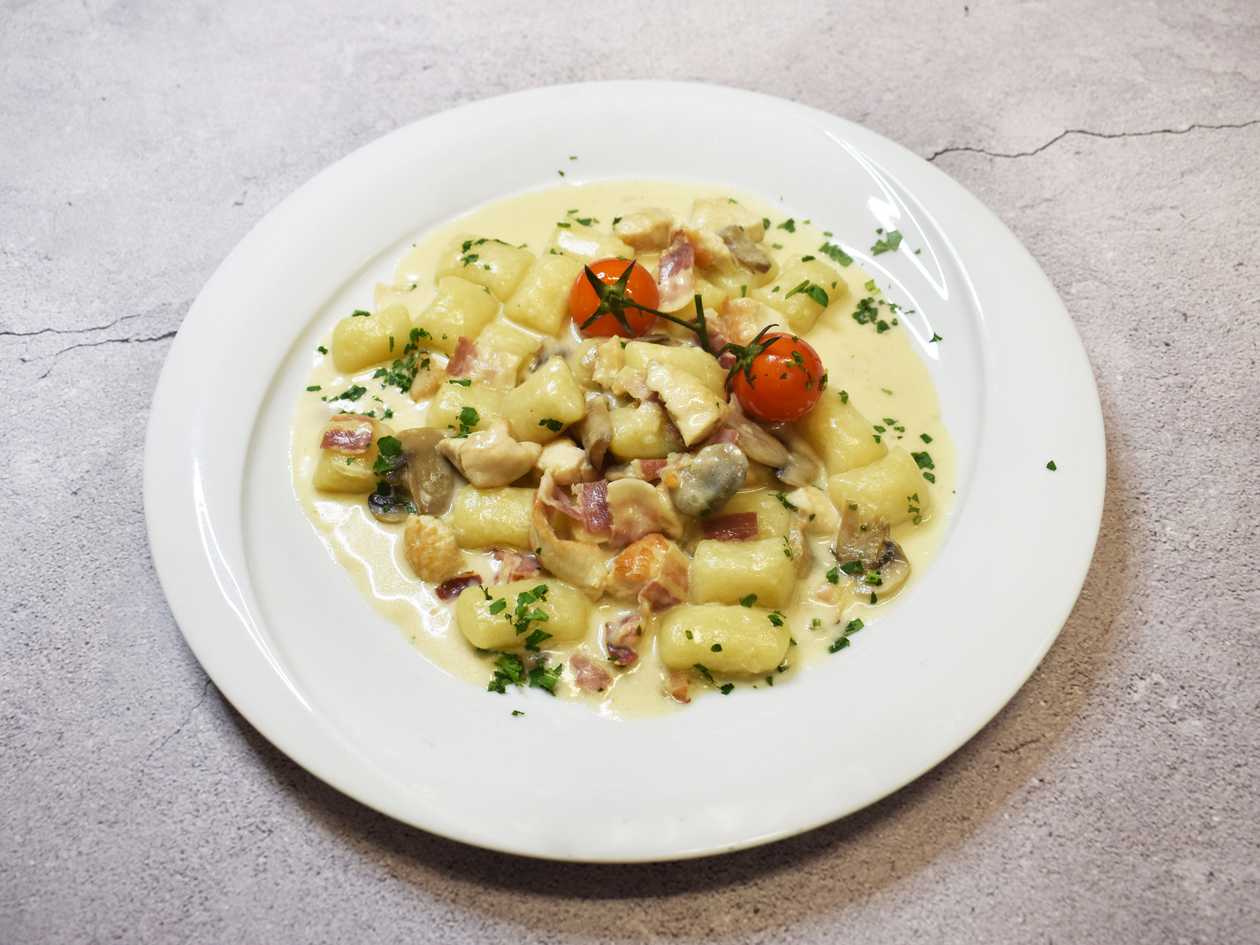 Gnocchi in turkey, mushroom and pancetta sauce