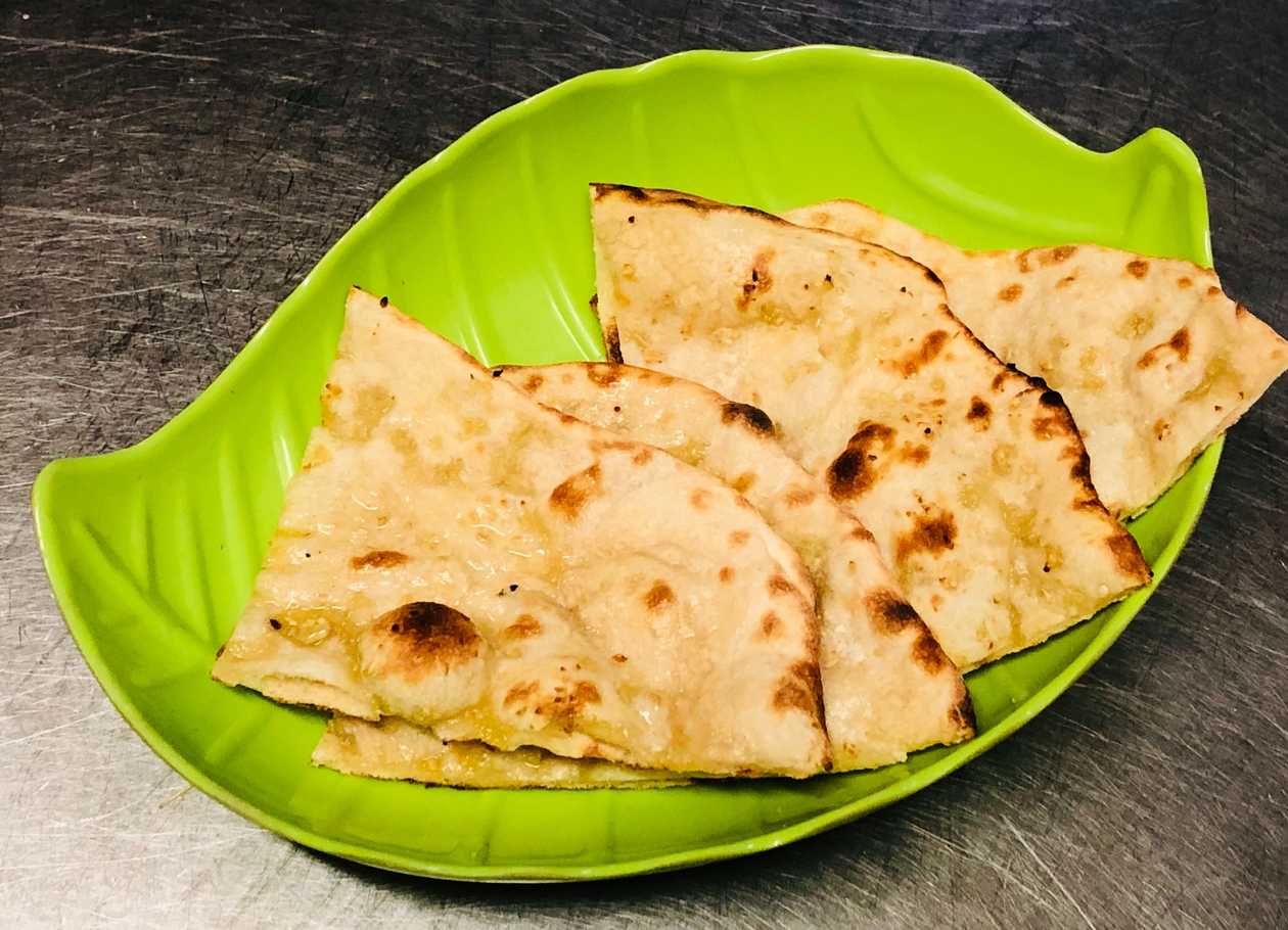 117. Garlic Naan (available 13.00-21.00)