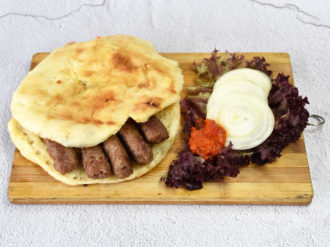 Small cevaps menu with a drink