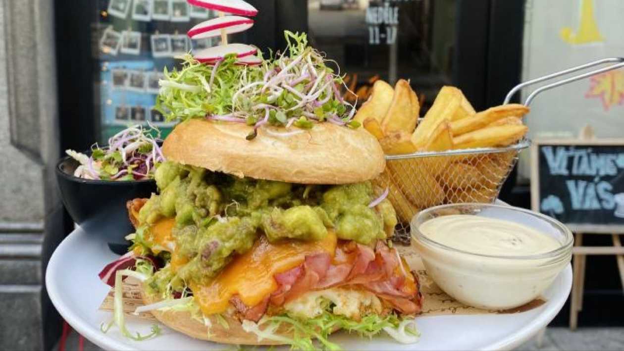 Guacamole bagel sandwich with bacon, mustard sauce