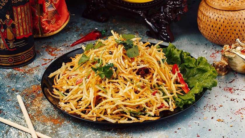 C4-Fried Potatoes With Red Paprika,Sesame Seed,Coriander And Hot Chili.