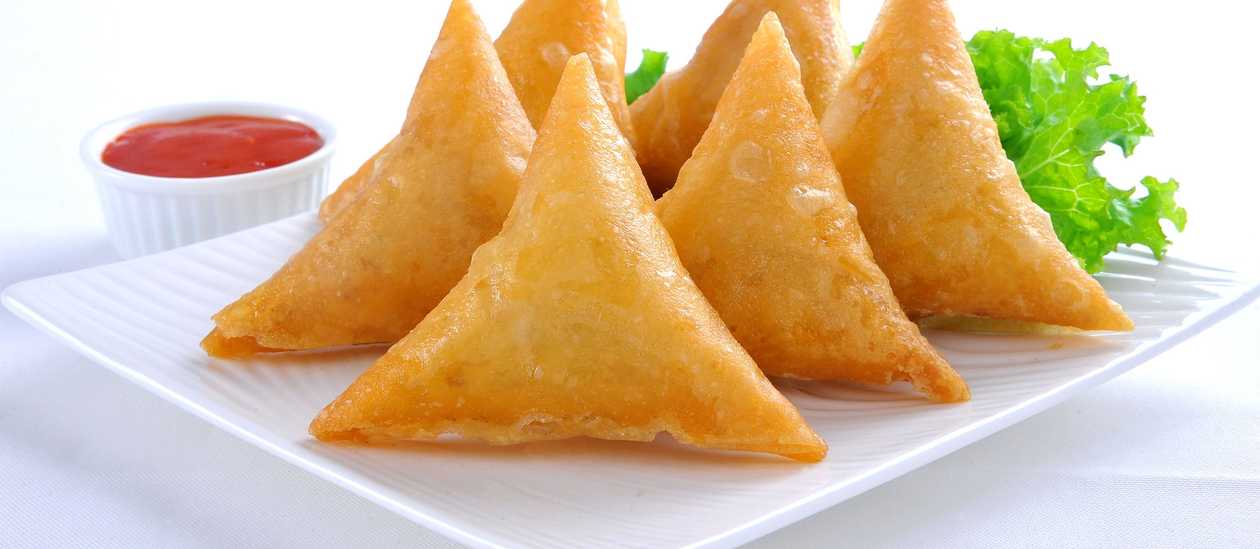 Samosa or Spring Rolls with a Drink