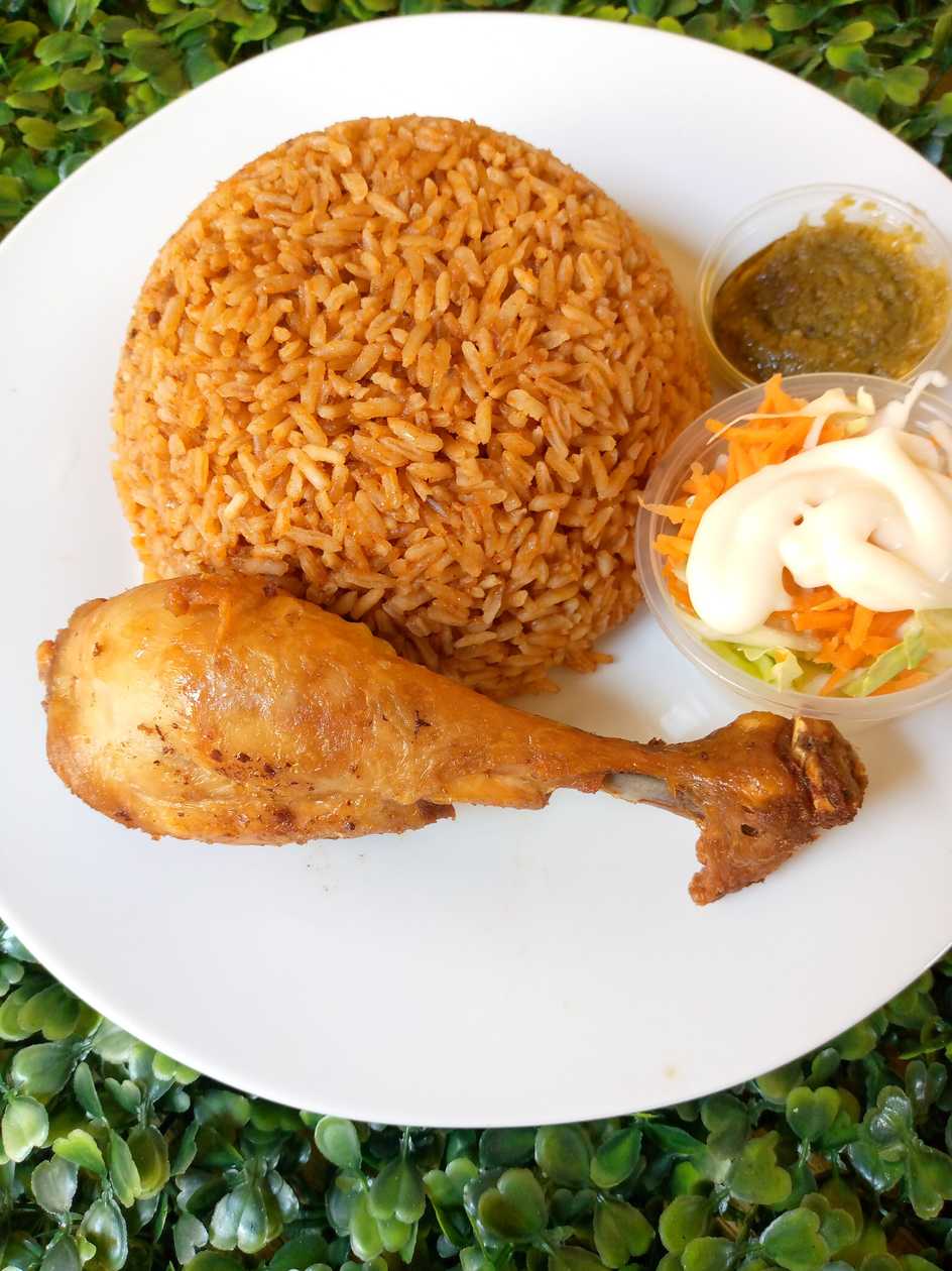 Jollof with Spiced Goat Meat+ coleslaw