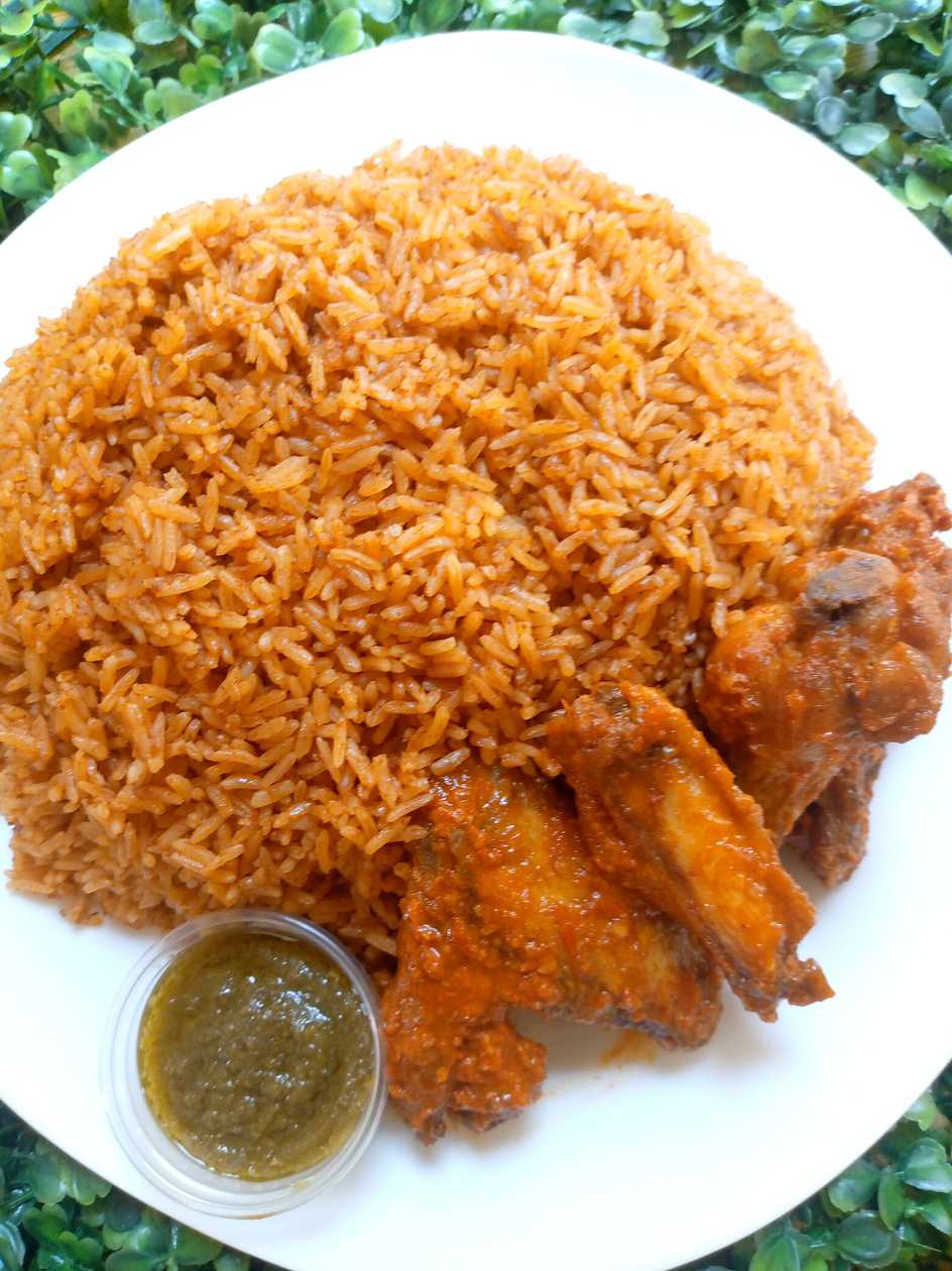 Jollof rice with spiced chicken wings+coleslaw