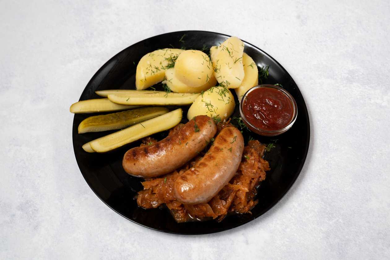 Smoked sausages with stewed cabbage.