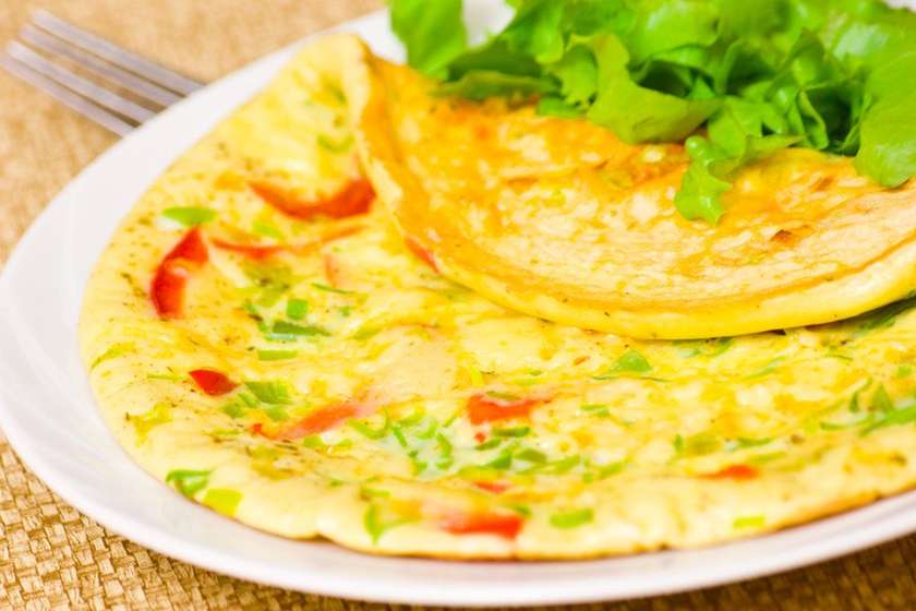 Omelette from 3 eggs with fresh vegetables