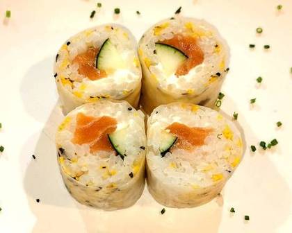 Vrdamaki roll with salmon, cucumber, and Philadelphia cream cheese.