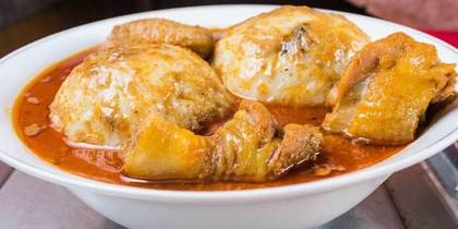 Rice ball and palm nut soup with dry tuna