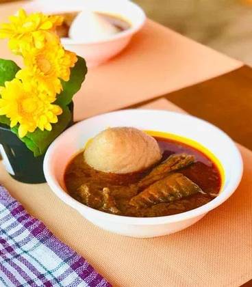 Banku and Palm Nut Soup with Fresh Salmon