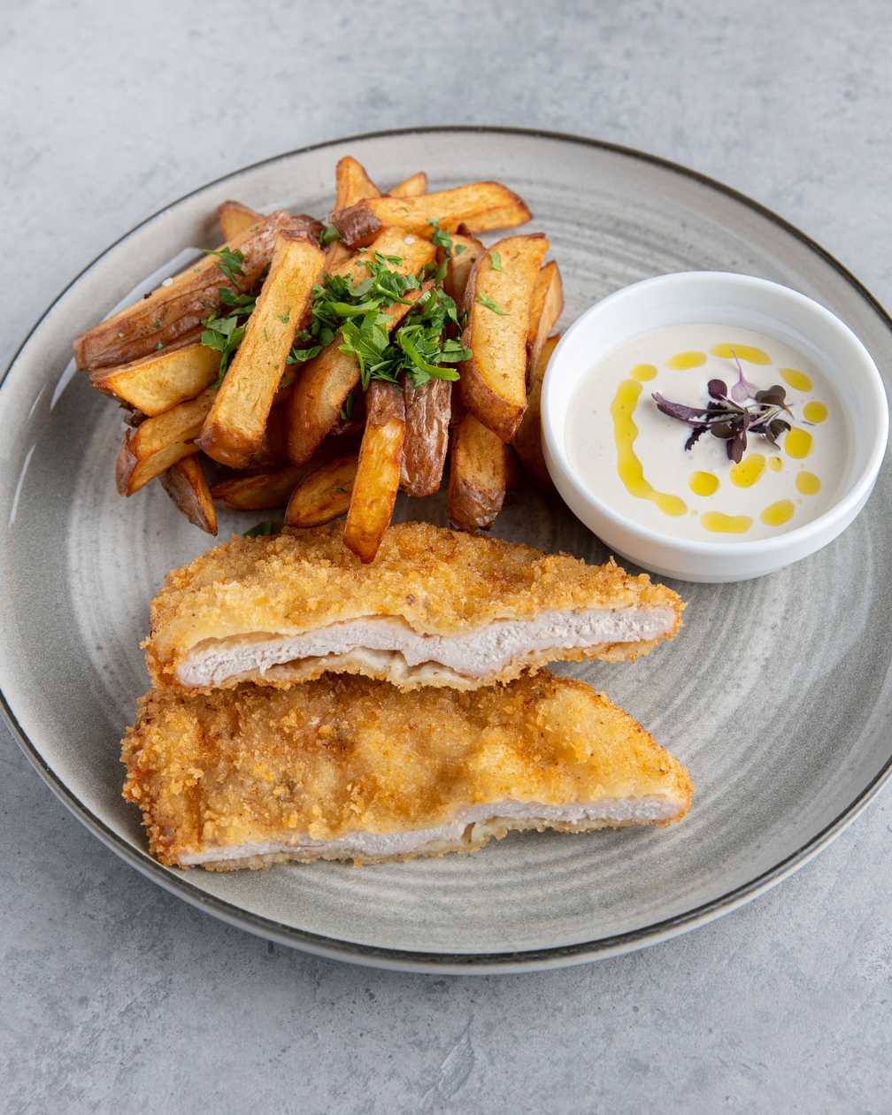 Crispy pork schnitzel with fried potatoes