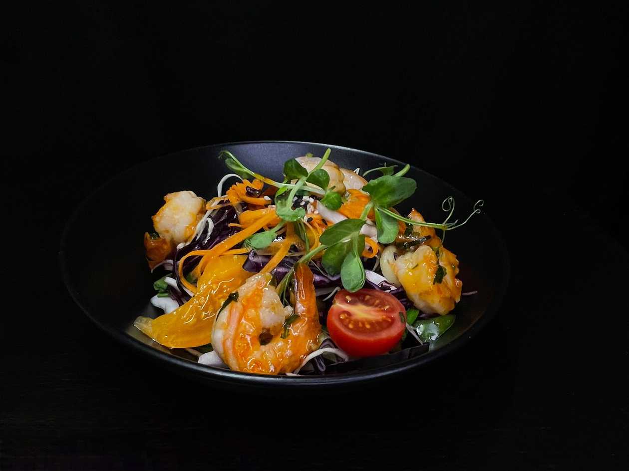 Fresh salad with mango salad dressing with tiger prawns