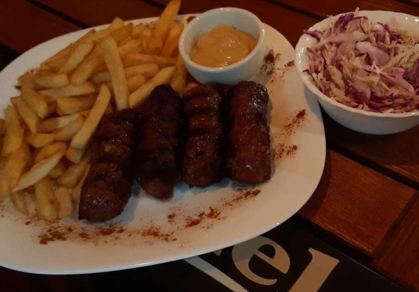 Grill minced meat rolls with mustard