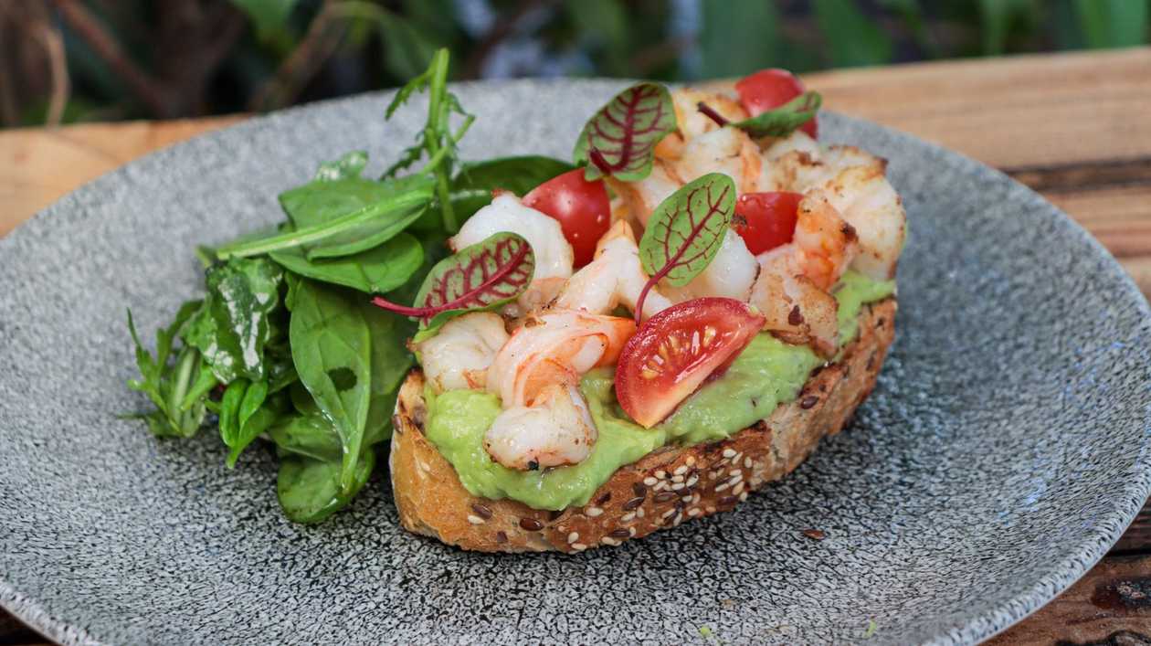 Avocado toast with shrimp and salad