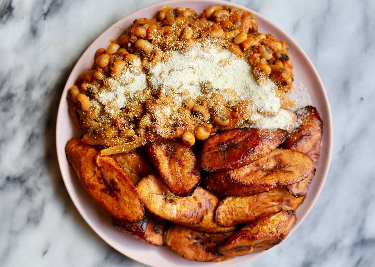 Rice with Salmon Beans Stew with Fried Plantain.