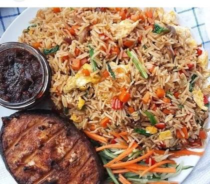 Assorted fried rice which chicken and fried plantain