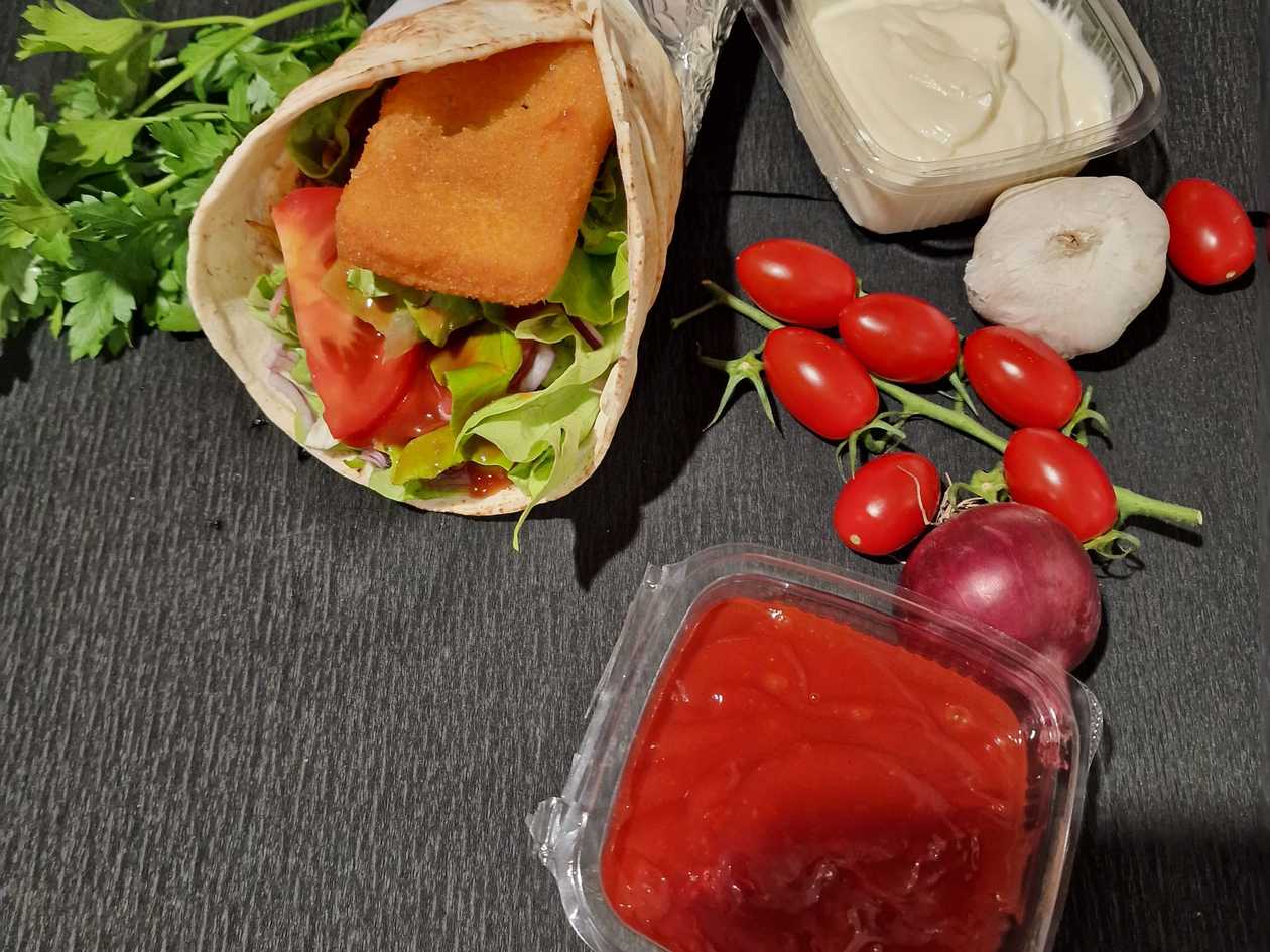 Fried cheese in a bun or pita bread + fries + juice + 2 sauces of choice