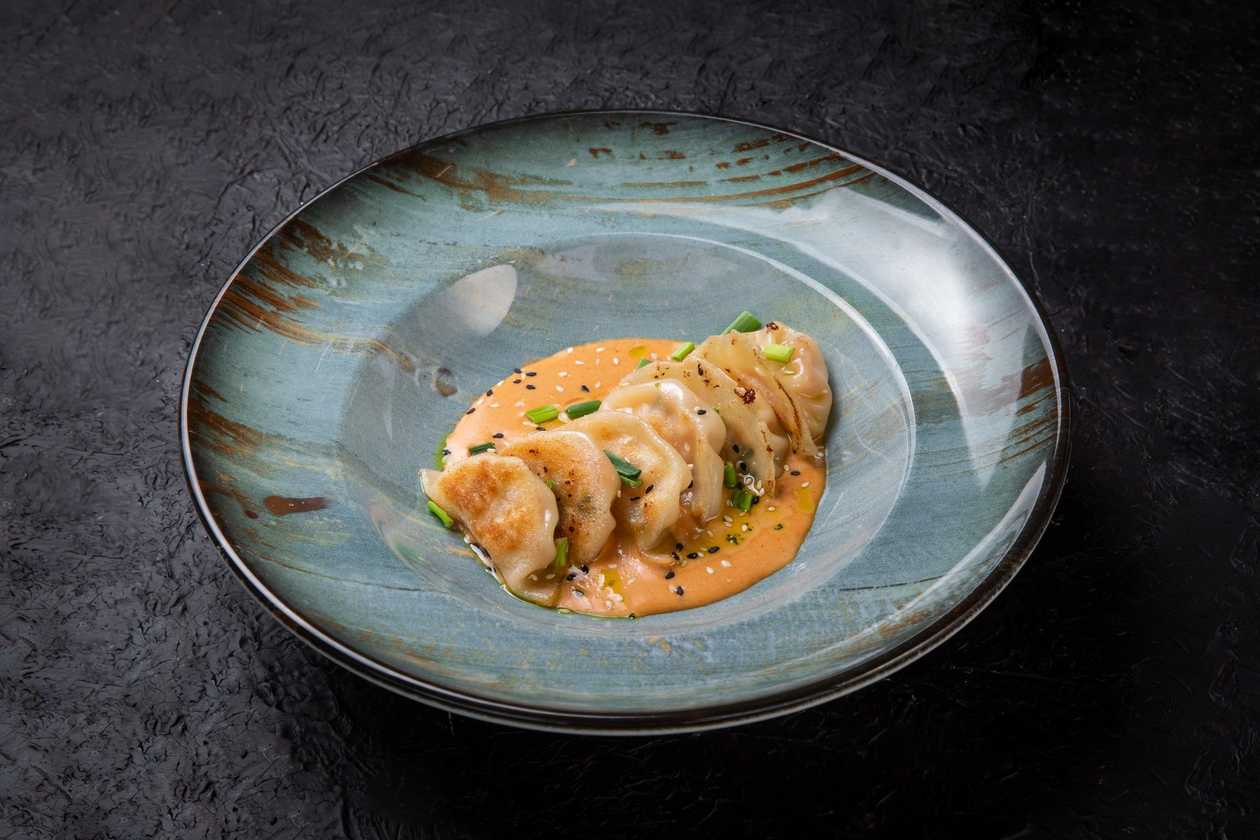 Godza with Salmon in tom yum sauce