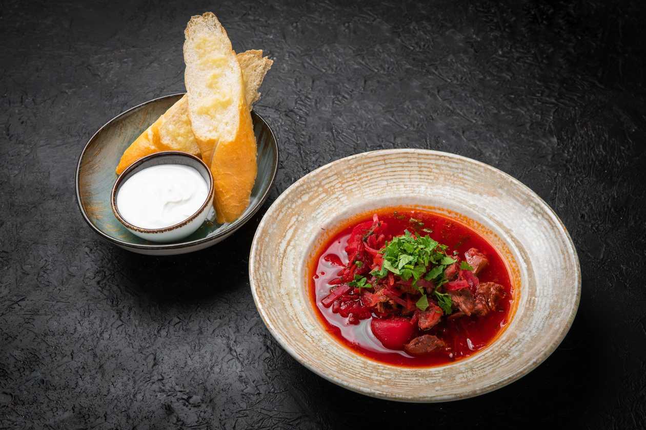 Borscht with garlic bread and sour cream