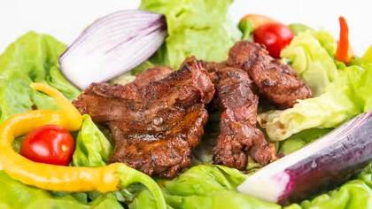 Grilled lamb pastrami meal with french fries