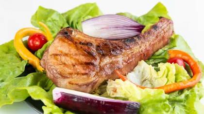 Grilled pork chop meal with french fries