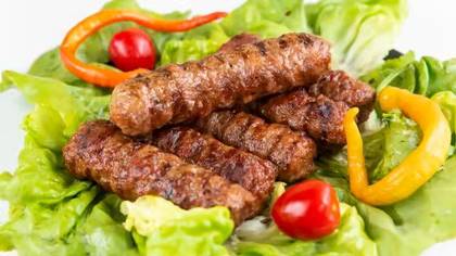 Meal with 5 grilled minced meat rolls with french fries