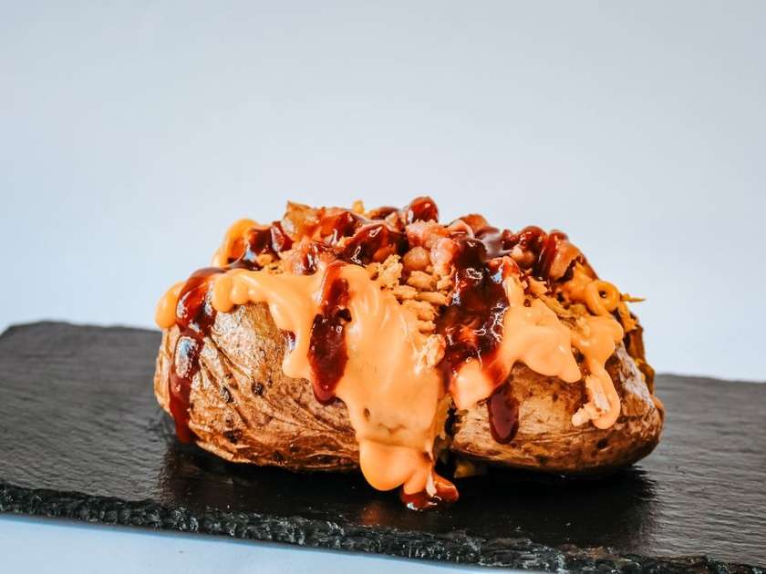 Chicken Stuffed Potato with Bacon, Cheddar and BBQ Sauce