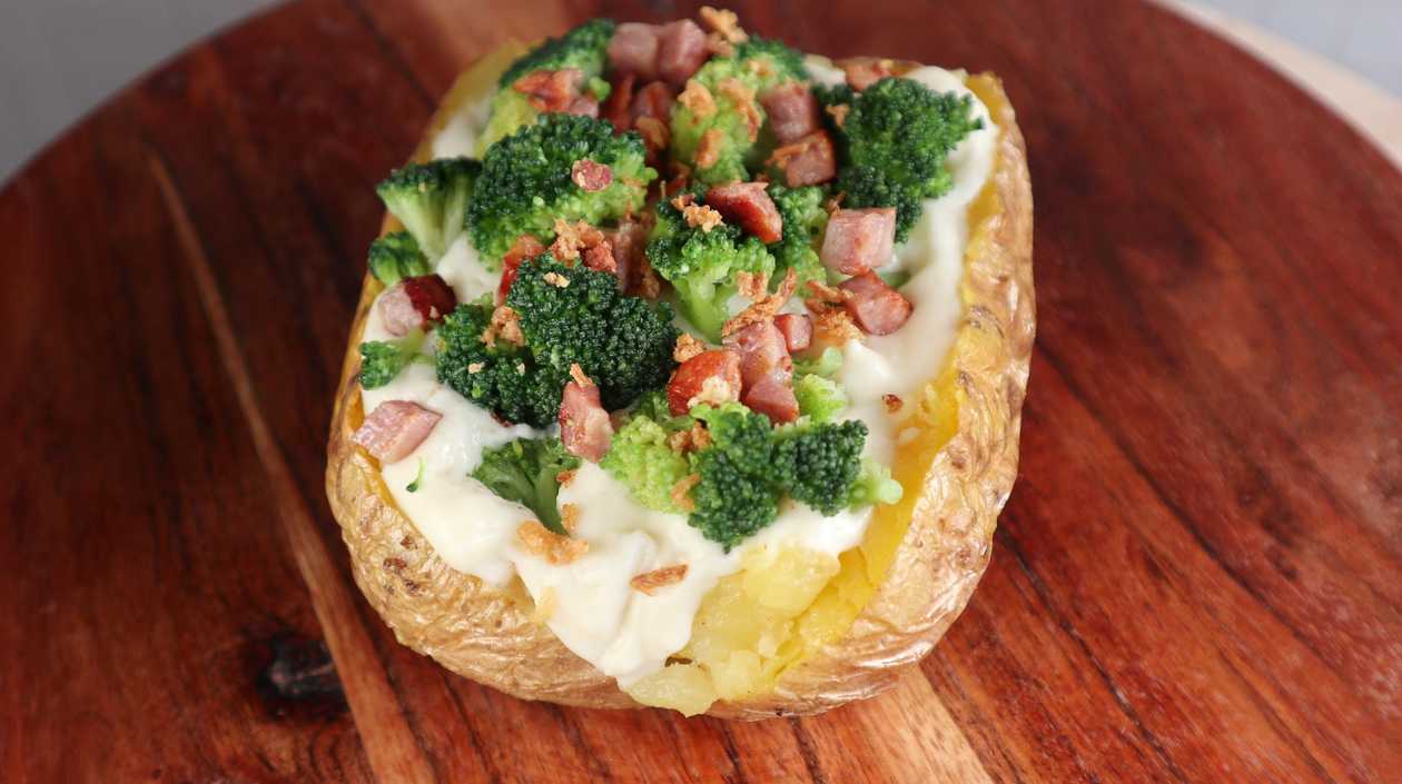 Broccoli and Bacon Stuffed Potato in Cheese Sauce