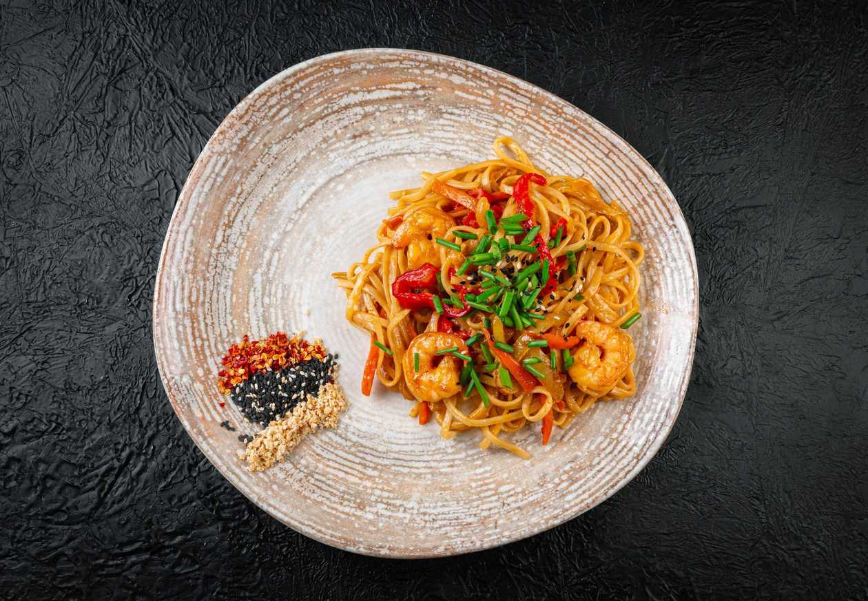 Noodles with seafood in tom yum sauce