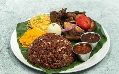 Waakye with meat,egg and wele