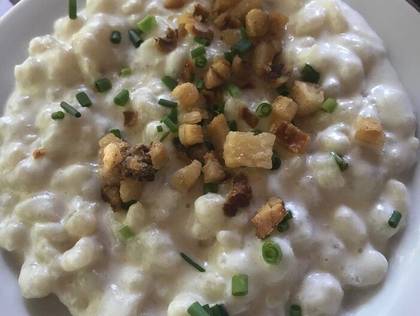 Potato dumplings with sheep's cheese, toasted bacon