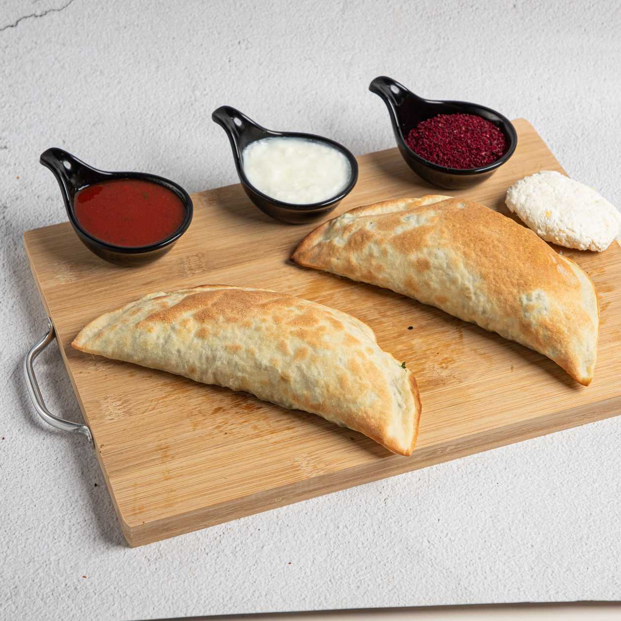 Herb and white cheese stuffed Qutab