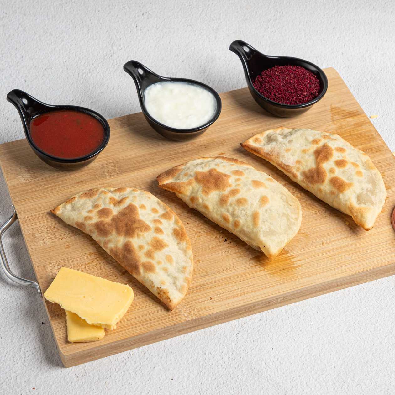 15 Pizza Qutab, 1 Acika, 1 Sumac, 1 Yogurt, 1 Coca-Cola 500ml