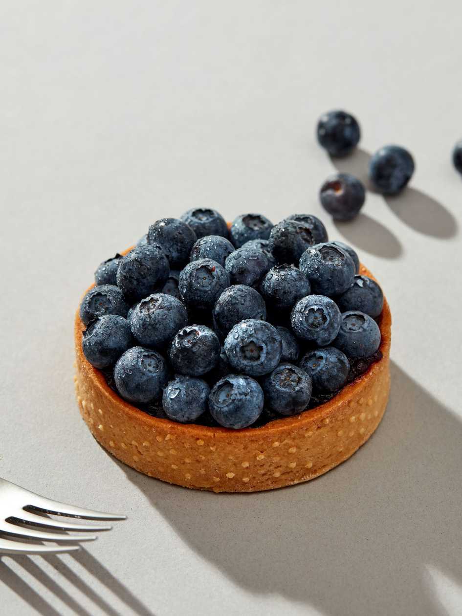 Almond cream tart with mint and blueberries