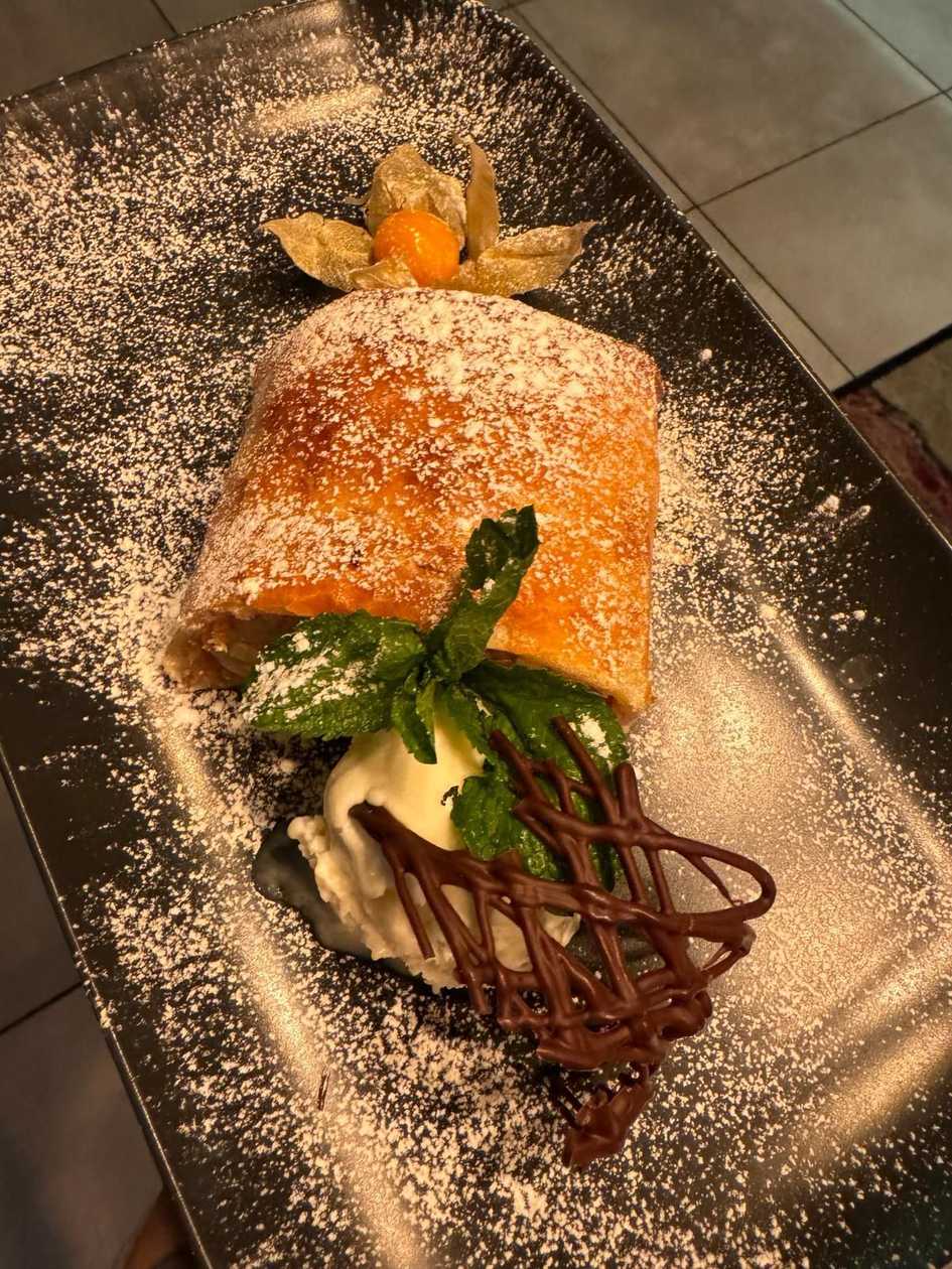 Apple strudel with ice cream scoop and vanilla sauce 250 g