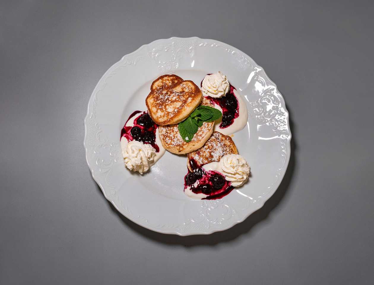 Pancakes with blueberries and sweet sour cream